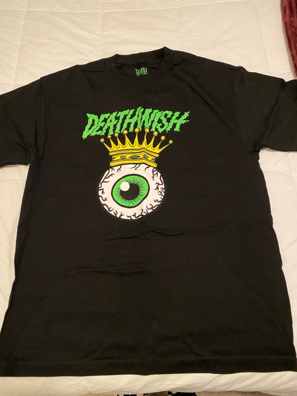 Black Short-Sleeve Tee with Green Eyeball Graphic